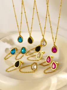 Close-up detail of 18k gold plated stainless steel teardrop rhinestone jewelry set.