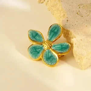 Elegante roestvrijstalen bloemenbroche met turquoise emaille, prachtig en chic sieraad.