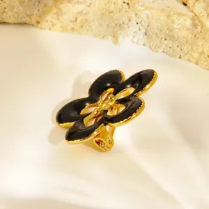 Broche fleur or noir élégante acier inoxydable émail mode bijoux accessoire style chic tendance