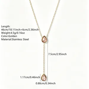 Stainless steel lariat necklace detail, pink teardrop crystal pendant, golden 18K finish.