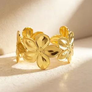 Gold stainless steel floral open cuff bracelet, elegant fashion jewelry accessory.