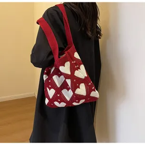 Knit shoulder bag with red and white heart pattern, casual daily commute style detail view.