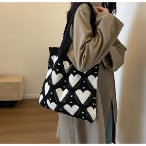 Black and white knit tote bag for women, stylish large capacity shoulder bag for daily commuting.