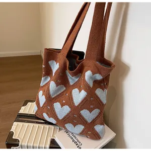 Knit tote bag with cute heart pattern, casual large capacity shoulder bag for women daily use.