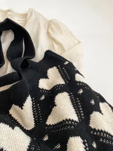 Korean style knit shoulder bag with black and white heart pattern, large capacity for daily use.