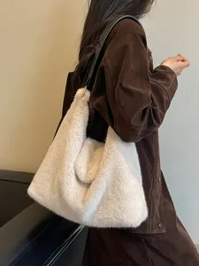 Fluffy plush shoulder bag for women, large capacity cozy winter hobo tote bag worn on-shoulder.