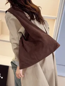 Stylish brown suede shoulder bag for women, slouchy large capacity tote for daily commute.