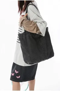 Casual large capacity washed denim shoulder tote bag for students and commuters daily use.