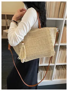 Woven straw tote bag for women, large capacity casual shoulder crossbody beach bag with tassel.
