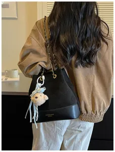 Stylish quilted bucket shoulder bag with chain strap and cute bear pendant for women