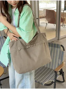 Moderna borsa a tracolla in tela grande capacità donna, shopper retro casual vista principale.