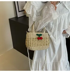 Straw woven handbag with cherry detail and pearl strap, pastoral style seaside vacation bag.