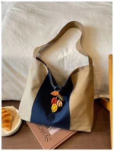 Retro kleurblok canvas tote tas met bladhanger, ruim en praktisch voor dagelijks gebruik.