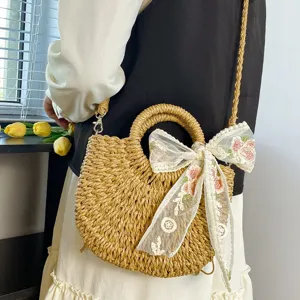 Bolso cruzado de paja estilo pastoral con bonito lazo de encaje floral para vacaciones.