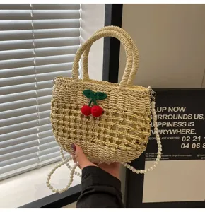 Straw woven handbag with cute cherry and pearl strap, perfect for summer beach and casual daily use.