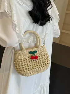 Pastoral style straw woven handbag for women, hollow design with cute cherry decor and pearl chain.