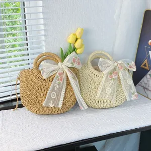 Bolso de paja estilo rústico con delicado lazo de encaje, ideal para vacaciones en la playa y uso diario.
