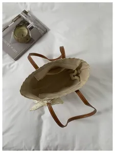 Sac cabas tissé en paille pour femme, sac à main de plage élégant avec poignées en cuir et fleurs.