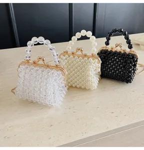 Chic beaded handbag set featuring clear, pearl white, and black kiss-lock purses with chains.