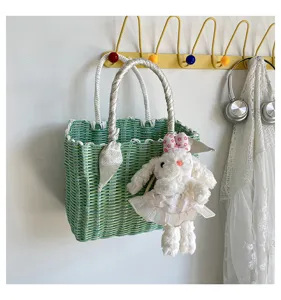 Korean style woven handbag summer cute tote bag with rabbit pendant for women casual travel.