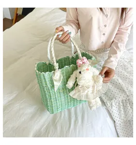 Korean style fresh woven basket bag summer travel cute handheld tote with bunny pendant.