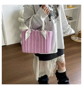 Pink woven basket handbag for women, cute summer beach tote and casual shopping shoulder bag.