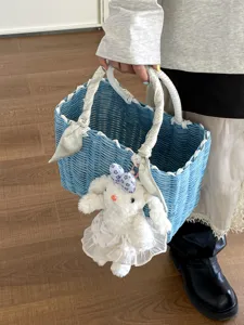 Korean style blue woven handbag with cute bunny plush pendant and ribbon handle for summer.