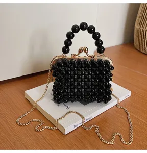 Black beaded mini crossbody bag with pearl handle and gold chain for women chic daily wear.