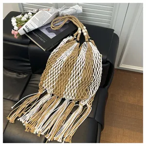 Detailed view of bohemian cotton woven fringe bag, hollow fishnet shoulder beach bag.