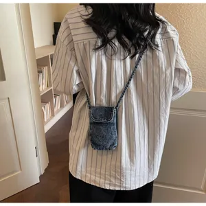 Retro minimalist denim crossbody phone bag for women, casual mini shoulder coin purse detail.