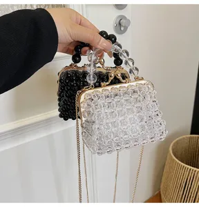 Detail view of cute beaded mini crossbody bag with crystal beads and gold kiss-lock clasp.
