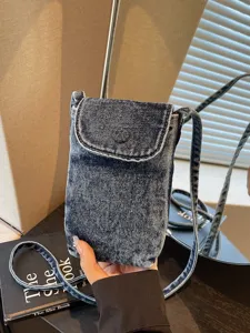 Retro minimalist denim cross-body phone bag for women, casual mini shoulder coin purse.