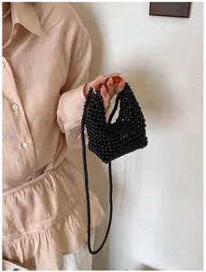 Black beaded mini handbag detail view, elegant handmade crossbody bag for women fashion.