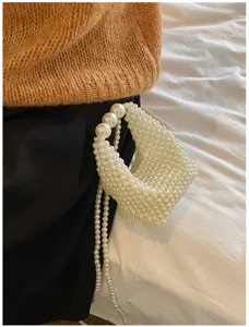 Detailed view of the elegant handmade pearl beaded handbag, showcasing intricate beaded craft.