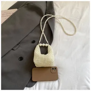 Detail view of a chic mini pearl beaded handbag featuring elegant handmade woven pearl design.