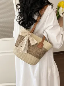 Womens straw tote bag with cute lace bow, stylish woven shoulder bag for beach vacation.