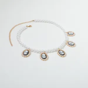 Vintage French pearl necklace with cameo portrait pendants, elegant clavicle chain for women.