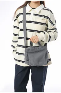 Vintage grey canvas shoulder bag for women, large capacity crossbody bag for daily commute.