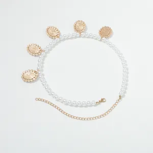 Elegant pearl necklace with vintage gold coin pendants, chic fashion accessory for women.