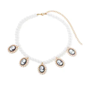 Vintage french style imitation pearl necklace with cameo pendants, elegant jewelry.
