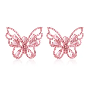 Close-up detail shot of sparkling pink rhinestone butterfly earrings, elegant and luxurious design.