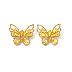 Detailed view of luxury retro rhinestone butterfly earrings, sparkling crystal claw chain design.