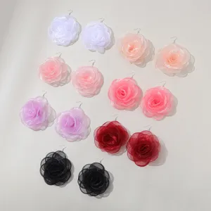 Oversized chiffon rose flower earrings detail view, showing exquisite 3D floral drop design.