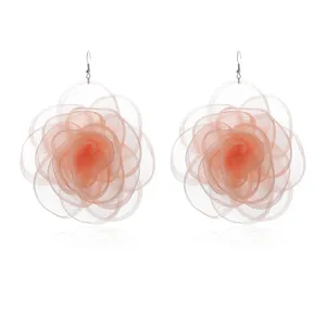 Chiffon fabric flower earrings detail view, large peach pink rose design, elegant statement style.