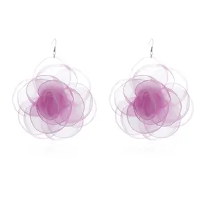 Detail view of large purple organza flower drop earrings, lightweight sheer floral design.