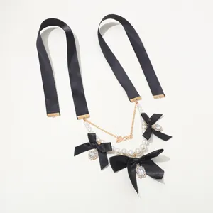 Vintage black ribbon pearl bow necklace with chic double layer design and metal love charm.