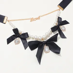 Vintage black ribbon pearl choker necklace with sparkling crystal bow and cute love pendant.