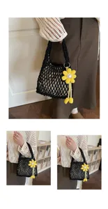 Black crochet net tote bag detail view with cute yellow flower pendant for casual summer beach.