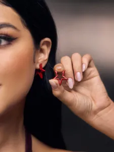 Red pentagram hollow earrings detail, minimalist Korean style alloy fashion jewelry for women.