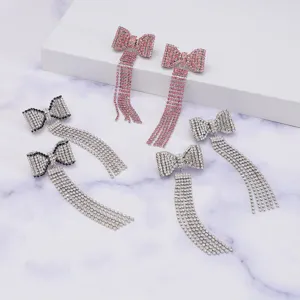 Sparkly rhinestone bow tassel earrings, luxury Y2K style long dangling ear jewelry for women.